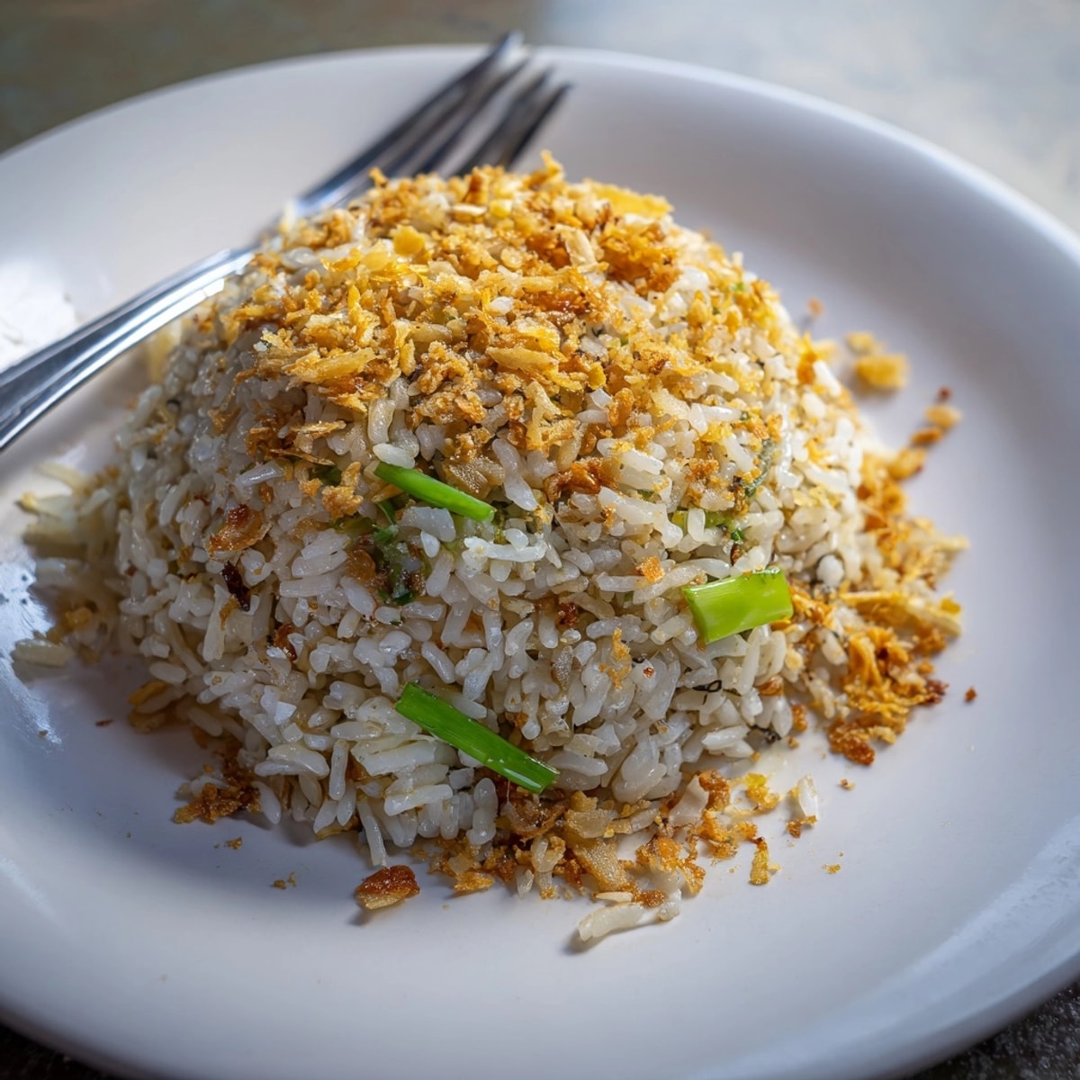 Golden Garlic Fried Rice: Fragrant rice dish sizzling in a hot wok, ready to serve.