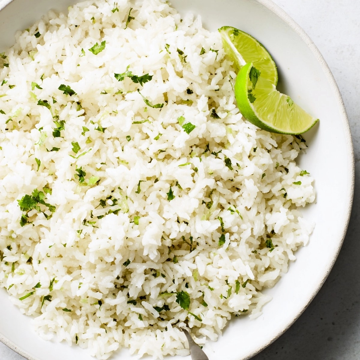 Fragrant, fluffy Coconut Lime Rice: a lime-zested vegan side dish, ready to serve.