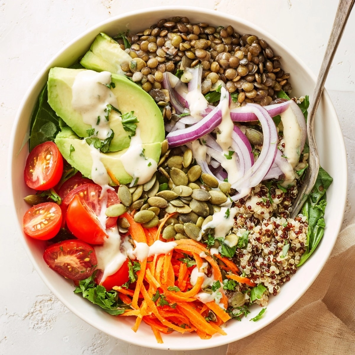 Overhead shot of a vibrant Vegan Lentil Power Bowl with colorful vegetables.