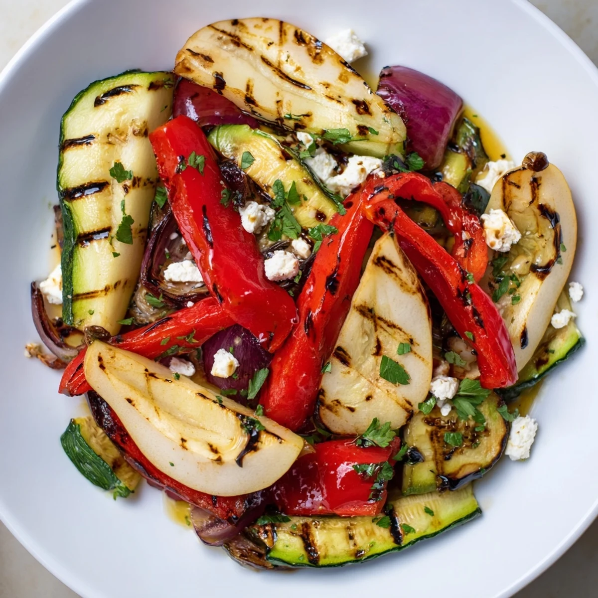 Golden-brown grilled pear recipe with colorful vegetables, perfect for a vegetarian side dish.