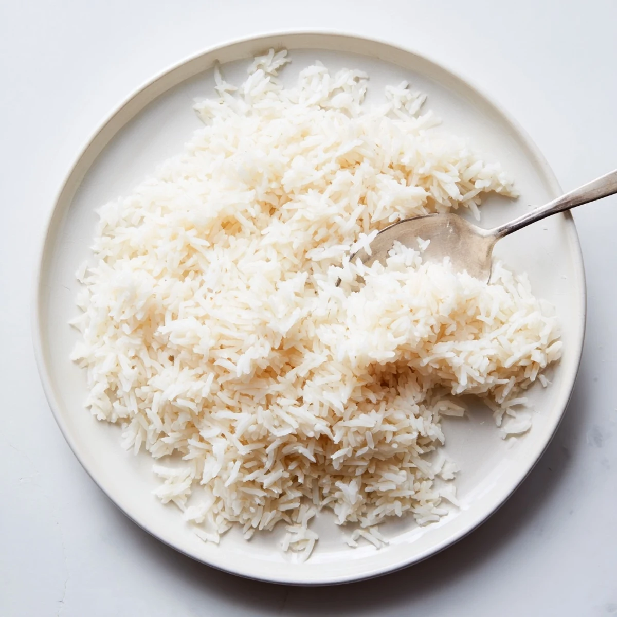 A mound of perfectly cooked Warm Rice, a versatile side dish for any hearty meal.