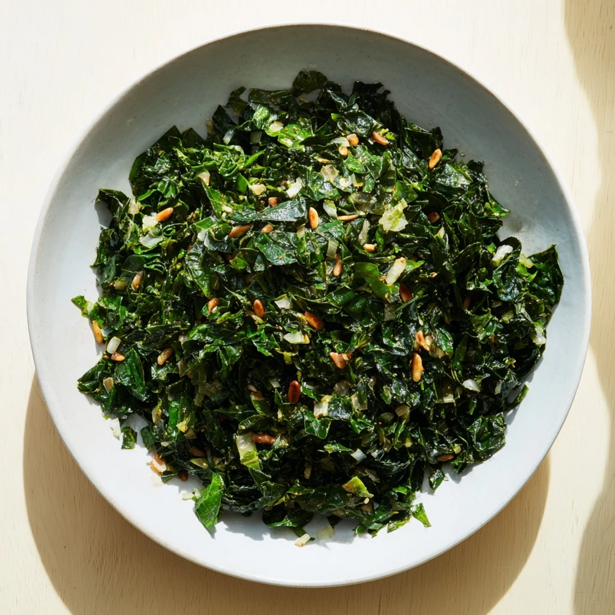 Steaming plate of Savory Winter Greens seasoned with garlic and spices, ready for your lunch.