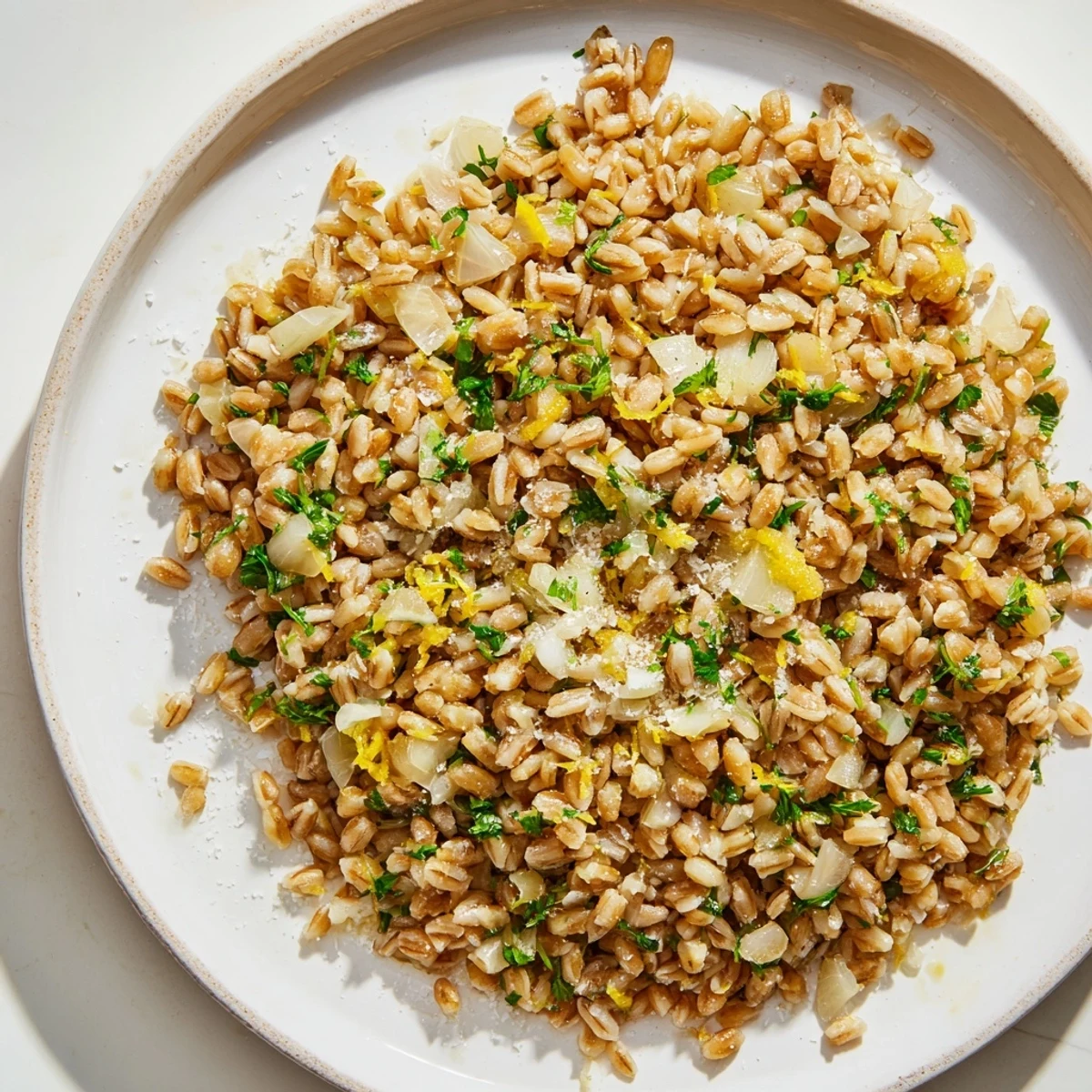 Golden-brown roasted farro glistening with olive oil, ready to serve as a tasty side dish.
