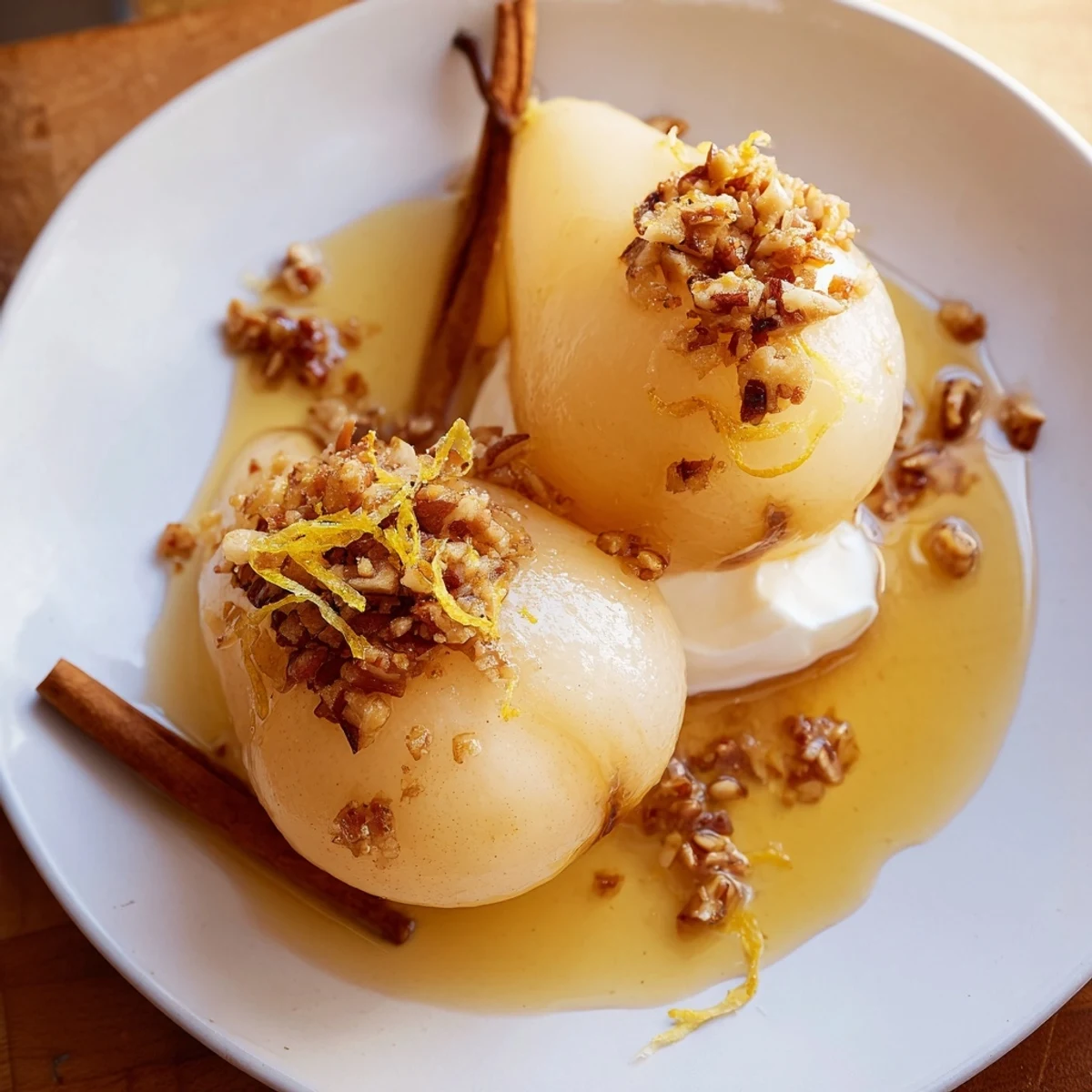 A close-up of Harvest Ginger Pear with glistening syrup and a sprinkle of pecans.