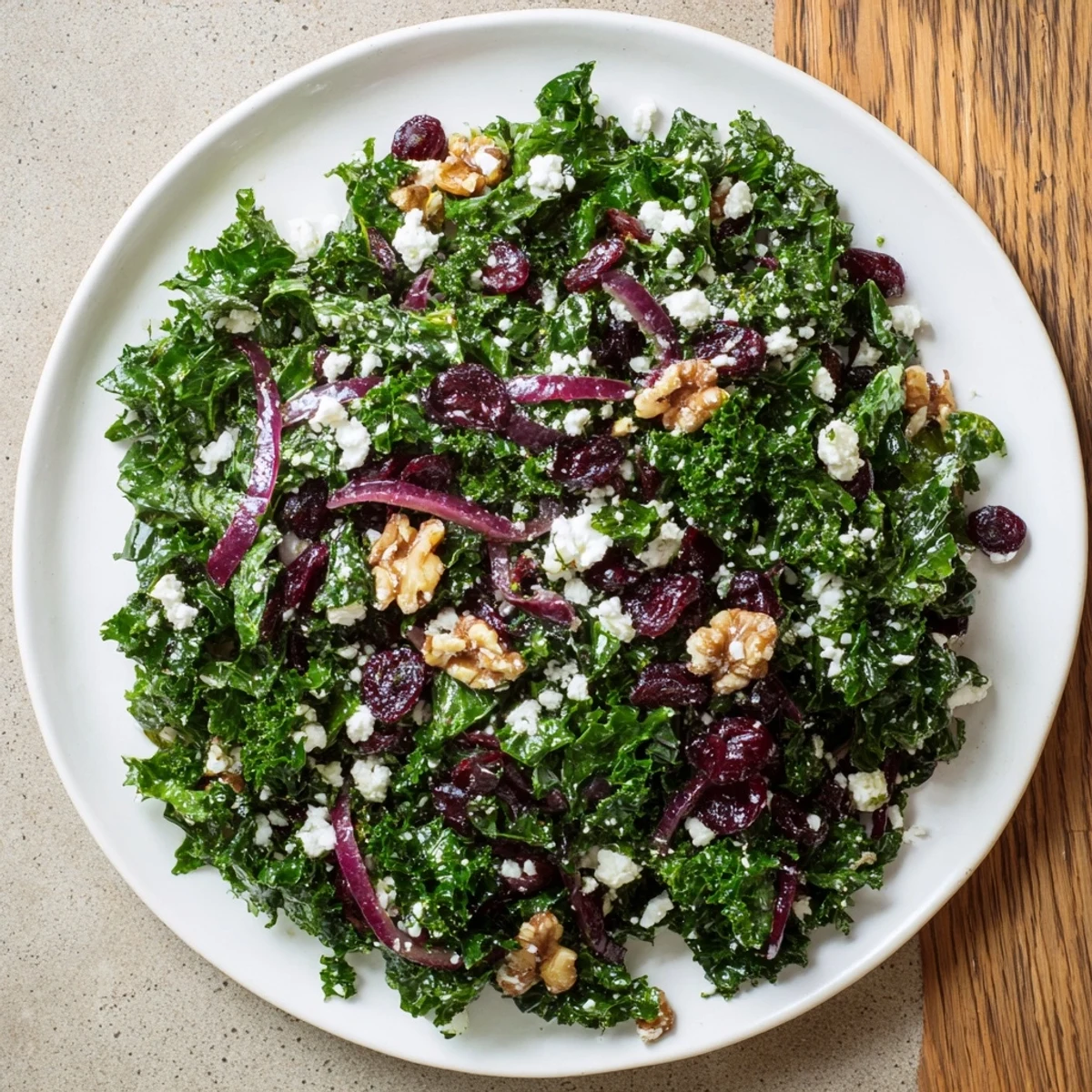 Vibrant Cranberry Kale Salad with ruby cranberries, walnuts, and a bright lemon vinaigrette for lunch.