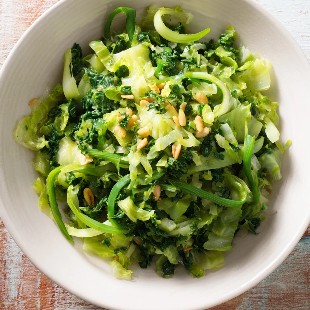 Warm bowl of Cozy Winter Greens featuring tender kale, Swiss chard, and a lemon-garlic aroma.