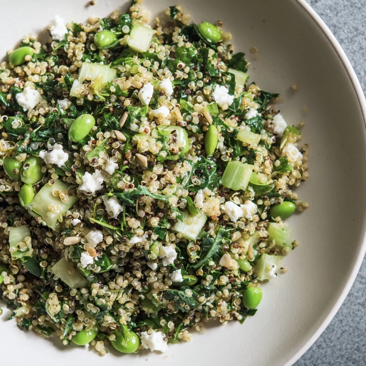 Emerald Savory Grain, a bright, colorful dish with fresh herbs and tender quinoa ready to serve.