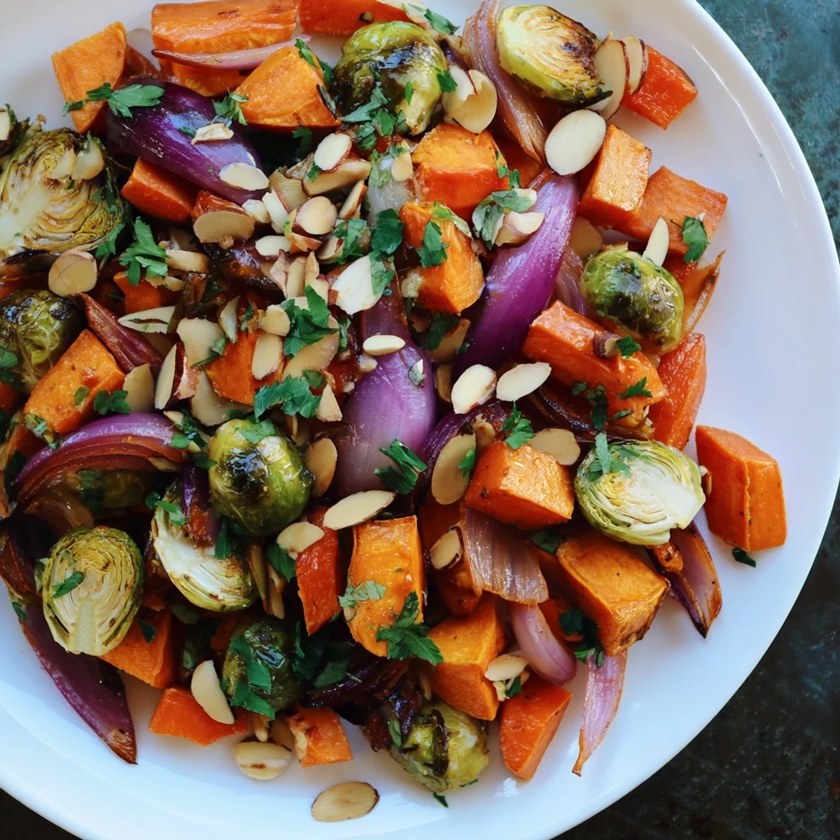 Close-up of crispy, toasted almonds and autumn vegetables in the Harvest Toasted Almonds dish.