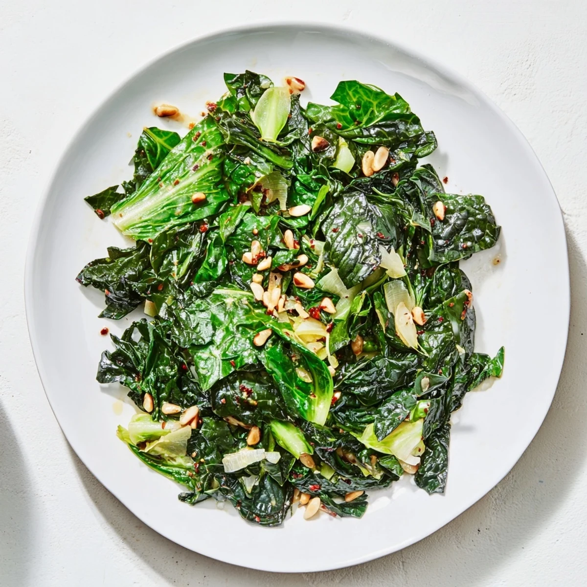 Steaming Warm Winter Greens, richly flavored, awaiting a bite of comforting garlic and lemon.