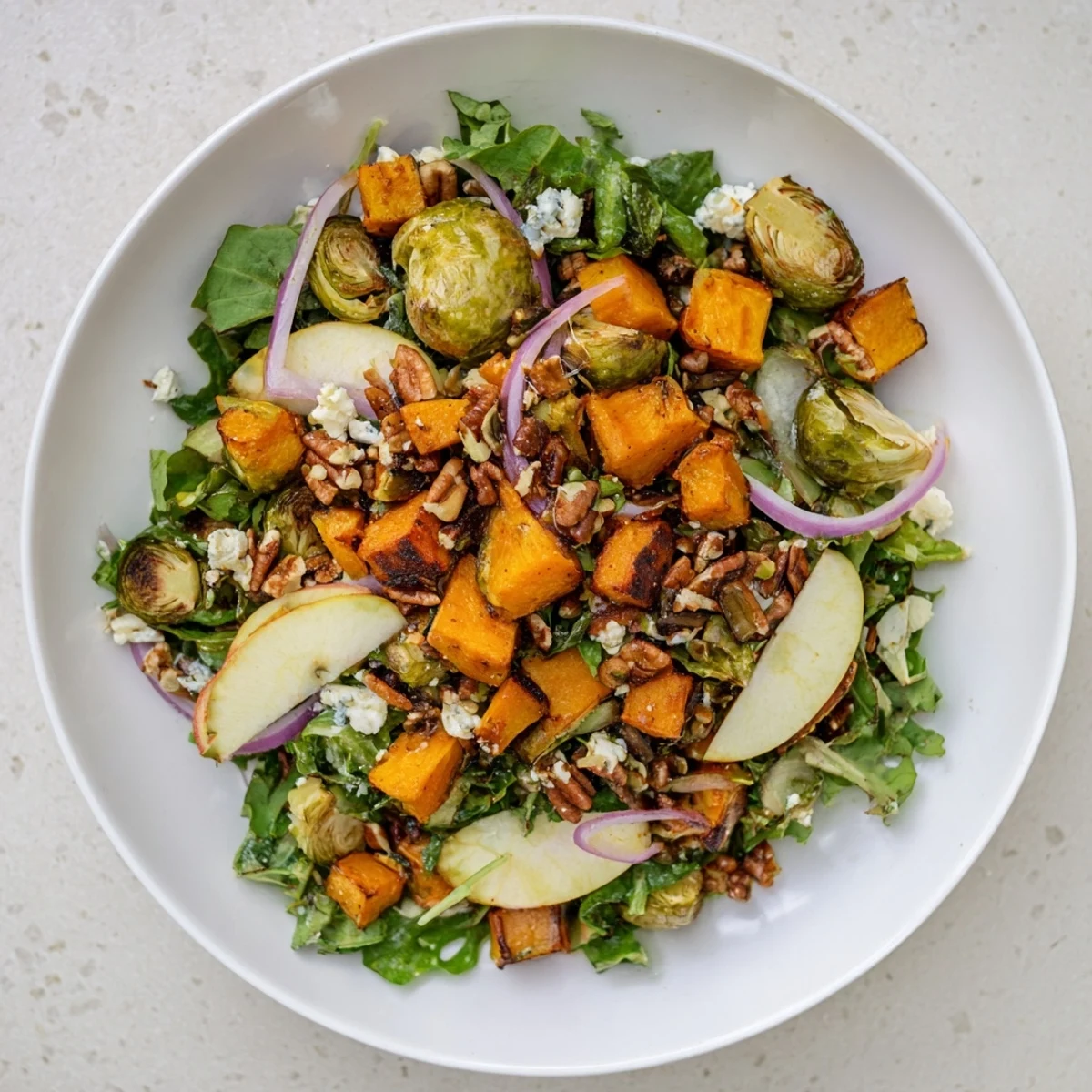 Vibrant Harvest Evergreen Mix salad with roasted veggies, toasted pecans, and creamy goat cheese.