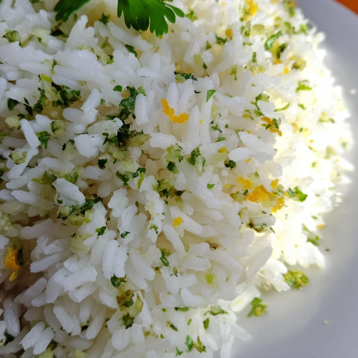 Bright Citrus Warm Rice served alongside grilled fish, showcasing fluffy grains and fresh herbs for a Mediterranean side.