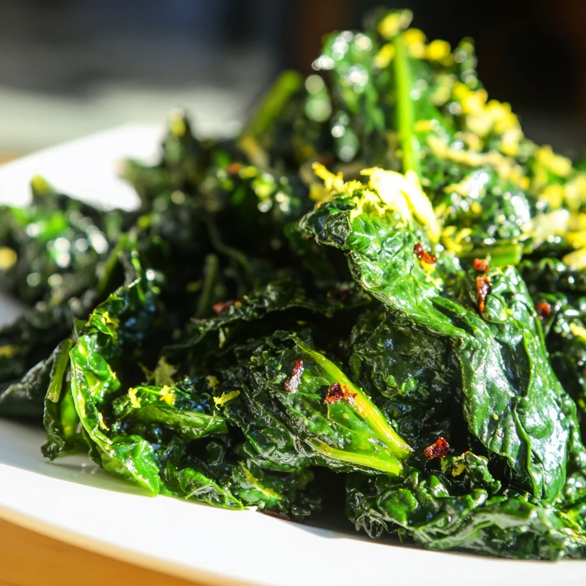 This image showcases the tender, wilted Emerald Winter Greens, perfect alongside a roasted main course, with bright lemon notes and a hint of garlic aroma.