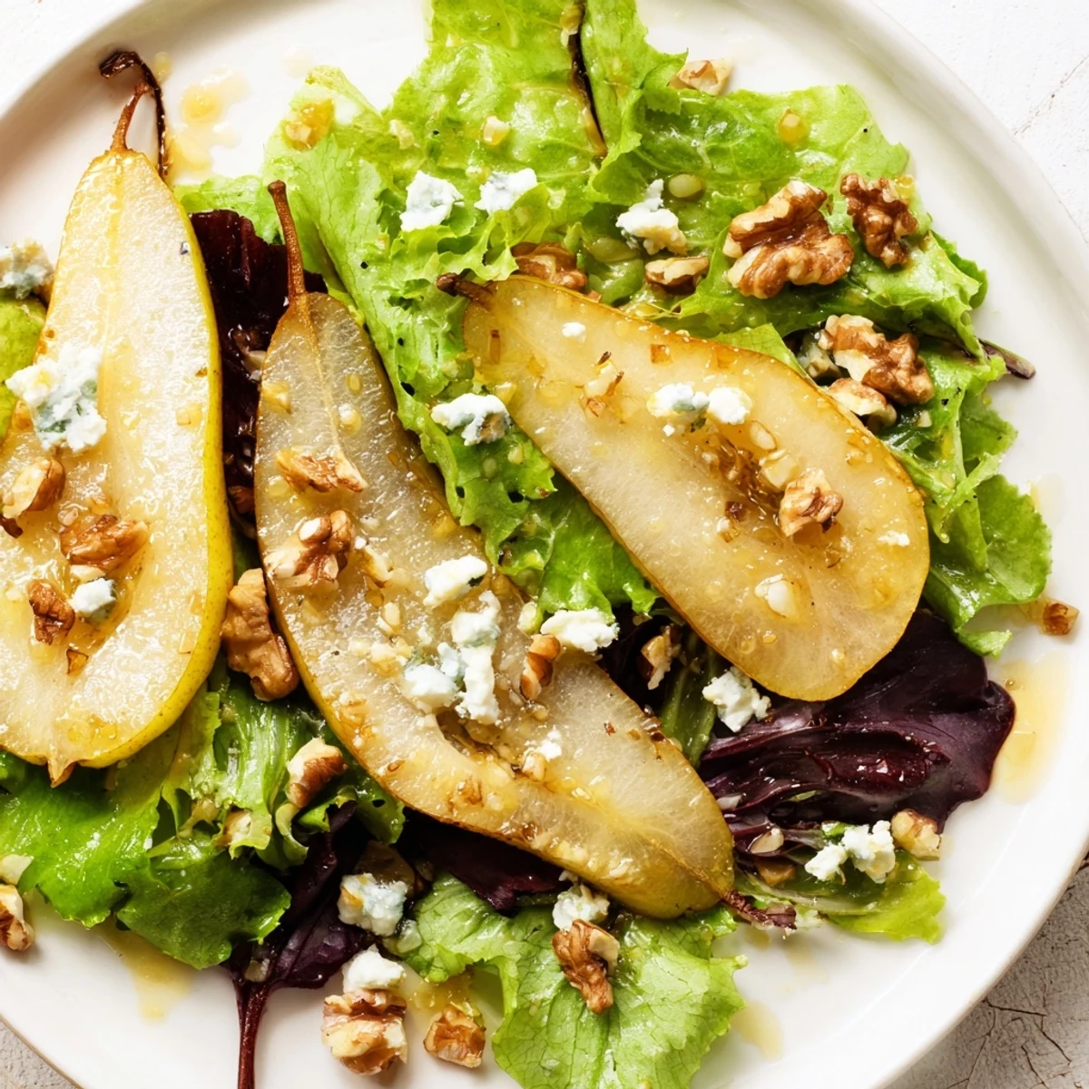 Vibrant Golden Pear Greens with red onion and walnuts, highlighting textures and flavors in a modern American salad.