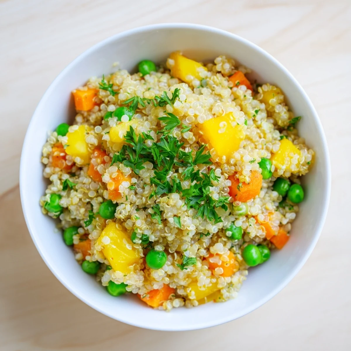Golden quinoa served warm alongside grilled chicken, topped with fresh cilantro and a squeeze of lemon for a gluten-free vegetarian dinner.