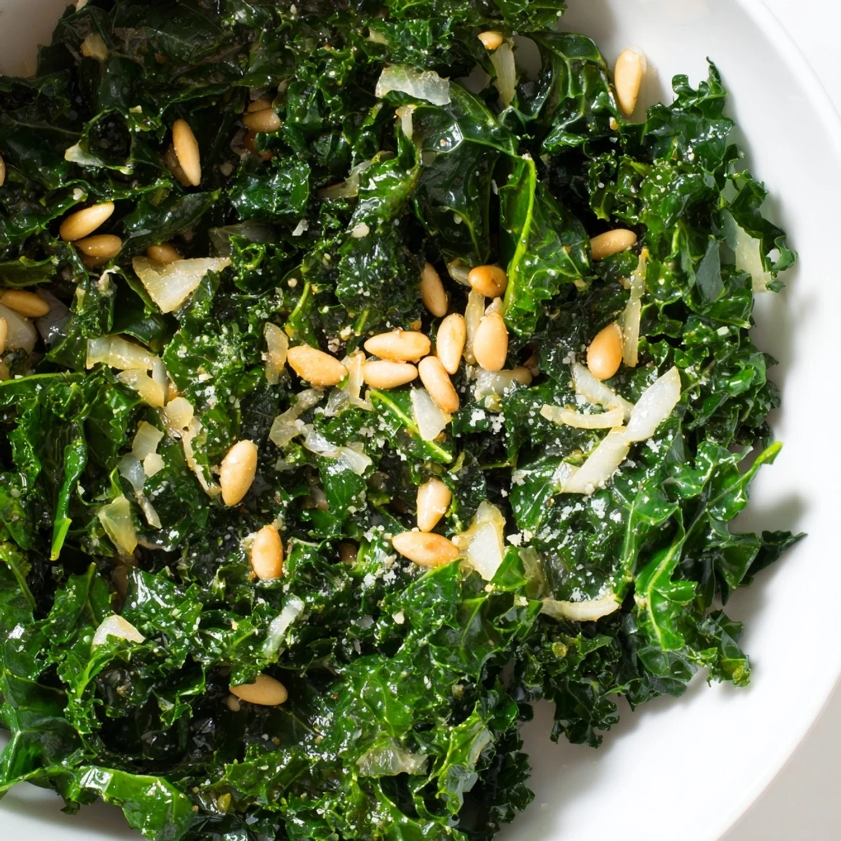 Serving suggestion of Cozy Kale as a warm side dish, plated alongside roasted chicken for a wholesome weeknight dinner.