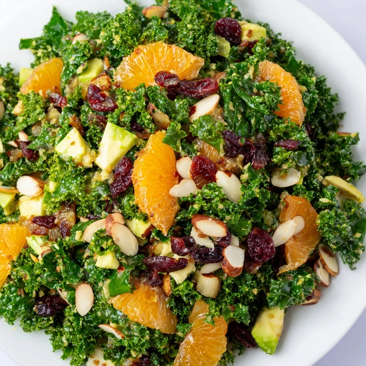 Freshly massaged kale topped with juicy orange and grapefruit segments, sliced almonds, and dried cranberries in a zesty citrus vinaigrette.
