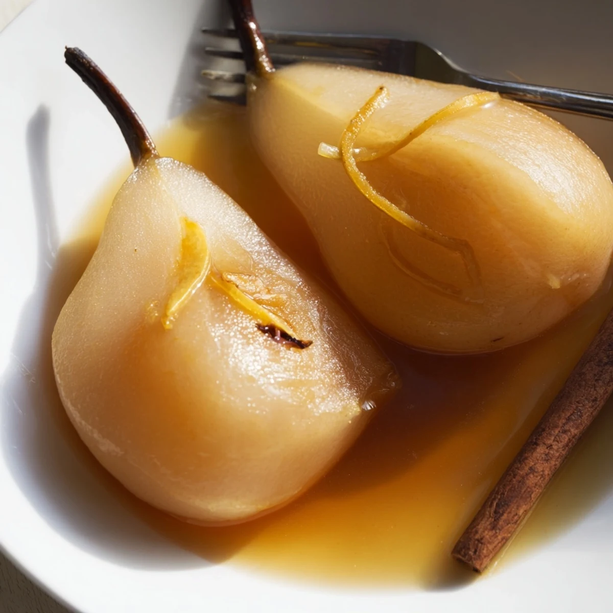 Elegant Root Ginger Pear dessert plated with a dollop of vanilla ice cream, perfect for dinner parties.