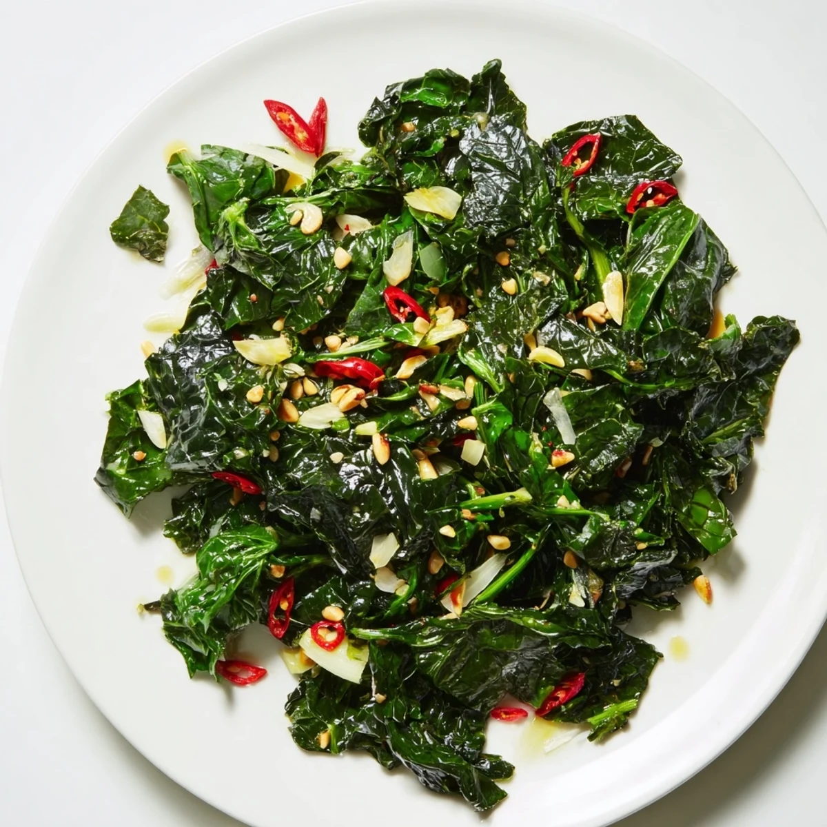 Sizzling pan of Bright Winter Greens with tender kale and chard, zesty lemon, and a hint of chili.