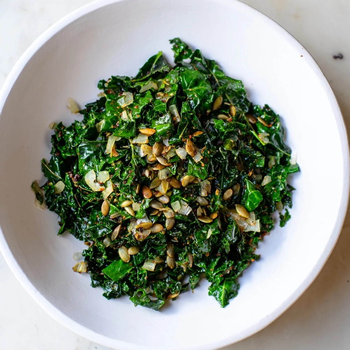 Sautéed Spiced Kale with aromatic cumin and coriander, served warm as a vibrant vegan side dish.