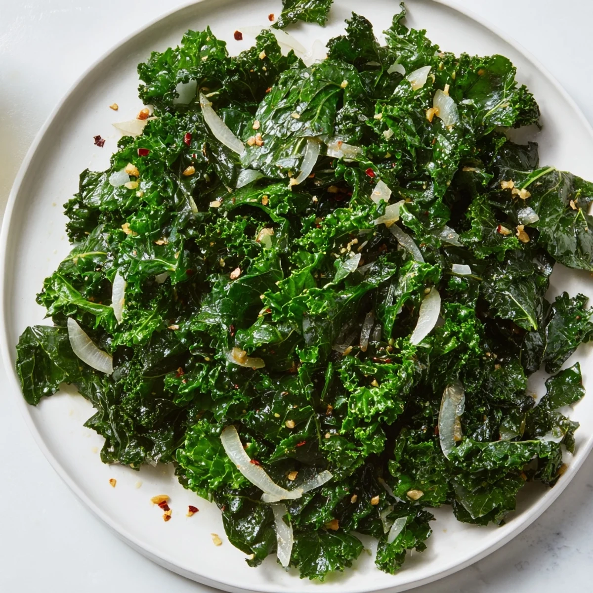 Vibrant ginger kale sauté with crisp green leaves, garlic, and soy sauce, served warm as a healthy side dish.