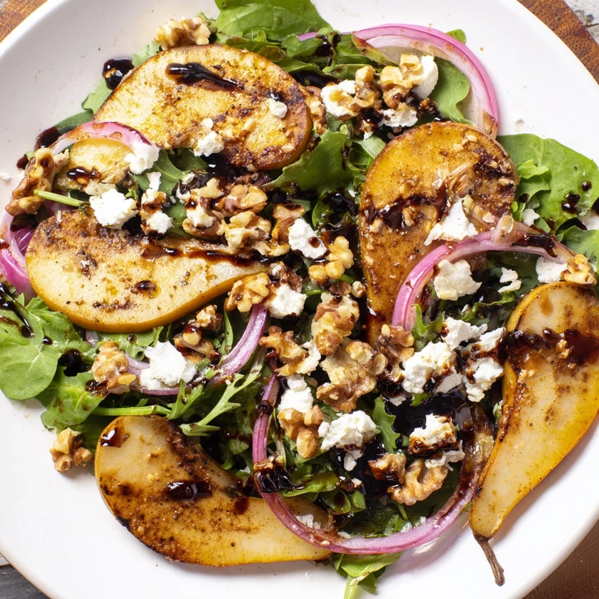 Golden roasted pears and toasted pecans on Hearth Pear Greens with balsamic dressing.
