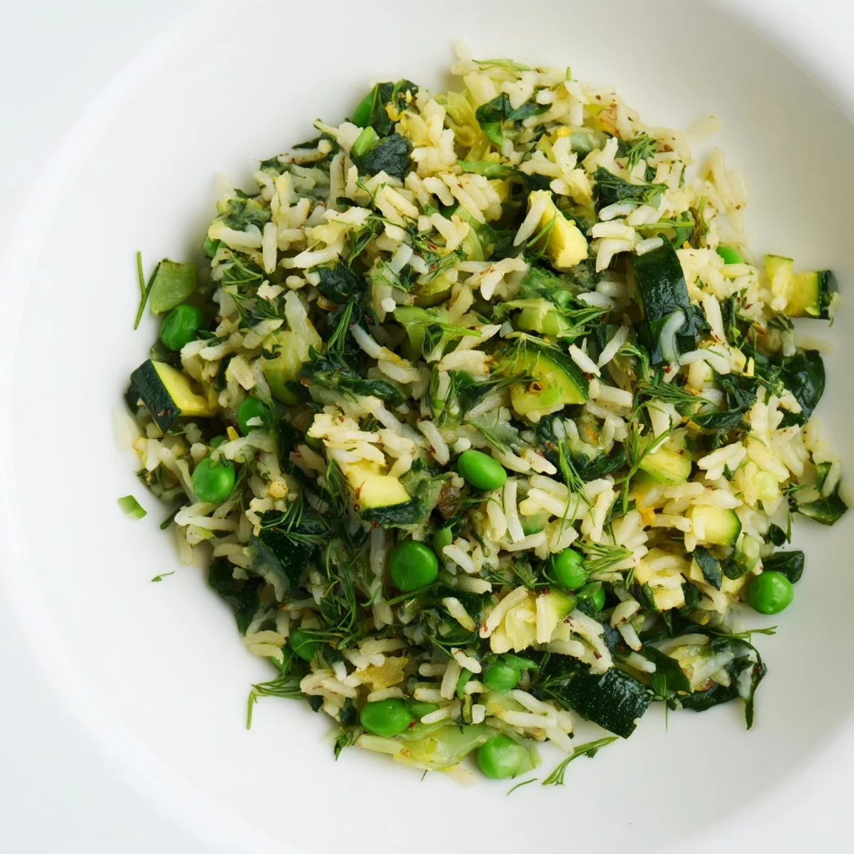 A close-up shows Evergreen Warm Rice glistening with olive oil and lemon zest beside a grilled chicken. 