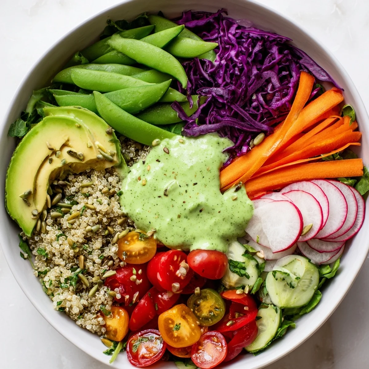 A vibrant Green Goddess Veggie Bowl with colorful veggies and a drizzle of zesty dressing.