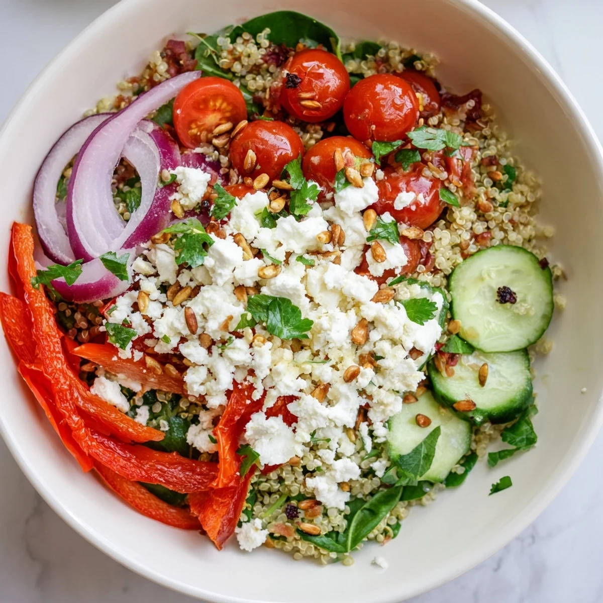 Hearty vegetarian meal with crisp cucumber, cherry tomatoes, and sunflower seeds for added crunch and nourishing texture.