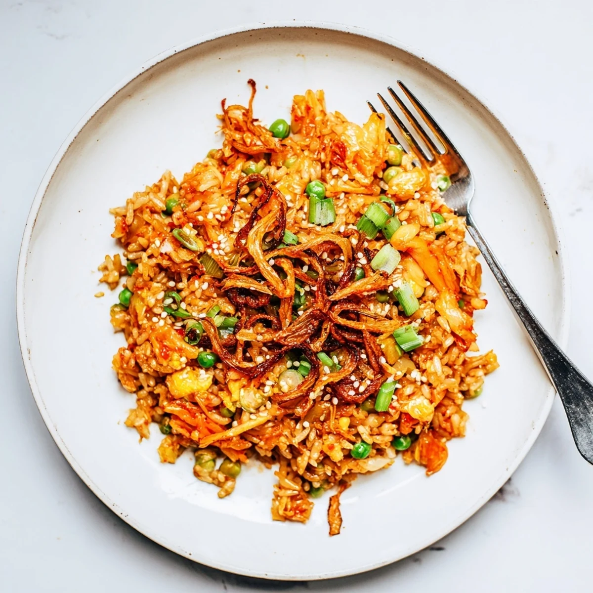 Vibrant Korean fusion fried rice with tangy kimchi aromatic garlic and golden crunchy shallots