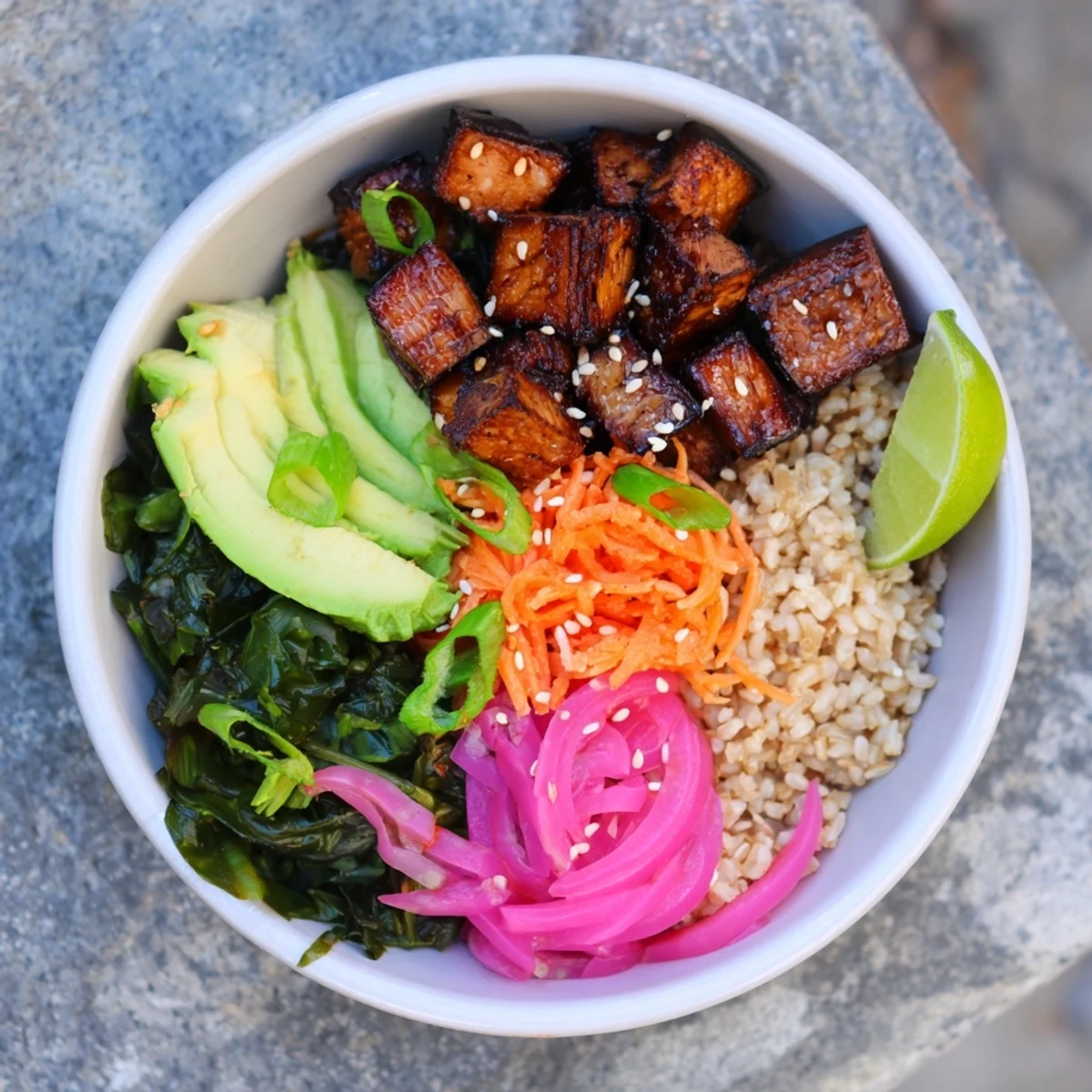 Golden caramelized maple miso roasted eggplant served over fluffy rice with crisp sesame greens
