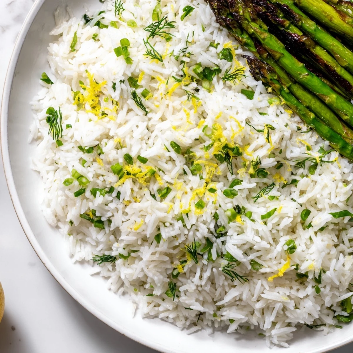 Vibrant side dish featuring aromatic Jasmine rice tossed with fresh herbs and smoky grilled asparagus