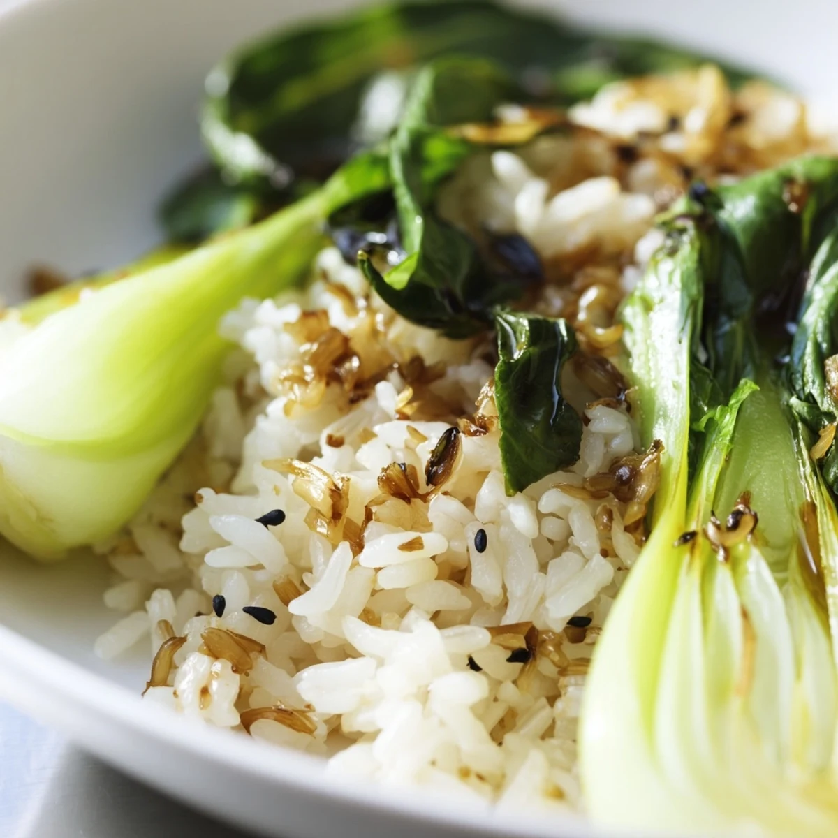 Steaming bowl of garlic ginger jasmine rice with bright green bok choy glistening