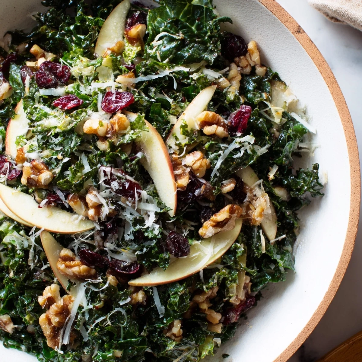 Crisp apple slices and toasted walnuts top this vibrant Kale Apple Walnut Salad