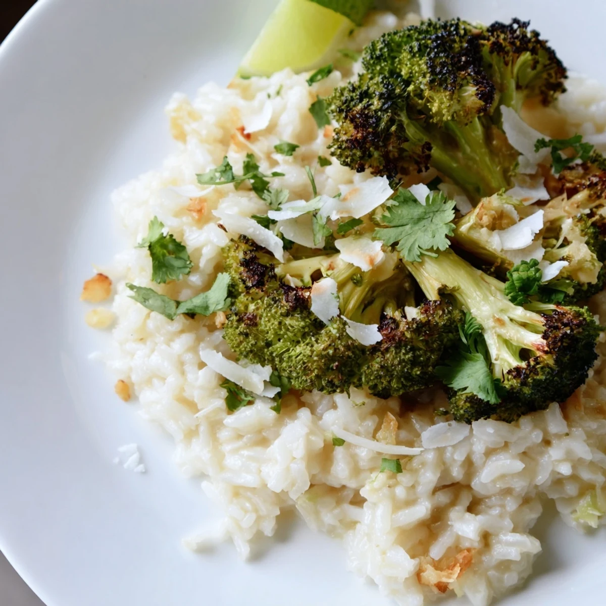 Creamy coconut ginger jasmine rice with roasted broccoli on a rustic wooden serving bowl