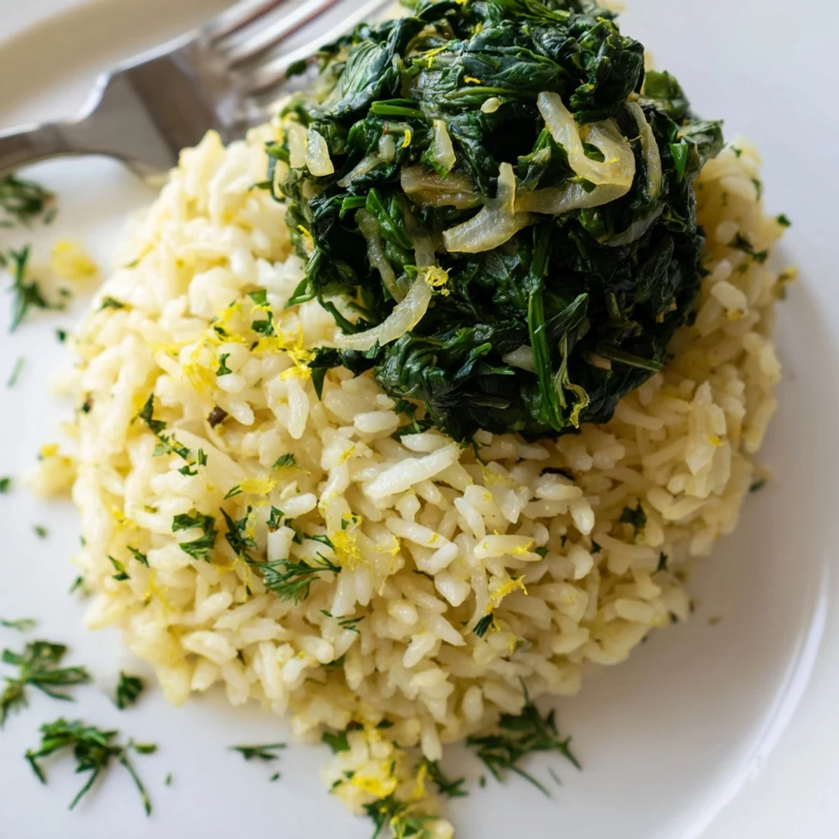 Fluffy garlic lemon herb rice topped with bright wilted spinach and fresh parsley