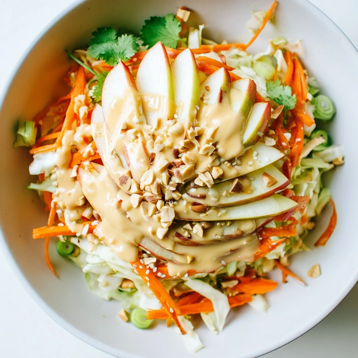 Shaved Cabbage Apple Carrot Salad Bowl with Sesame Dressing, crisp tangy and crunchy
