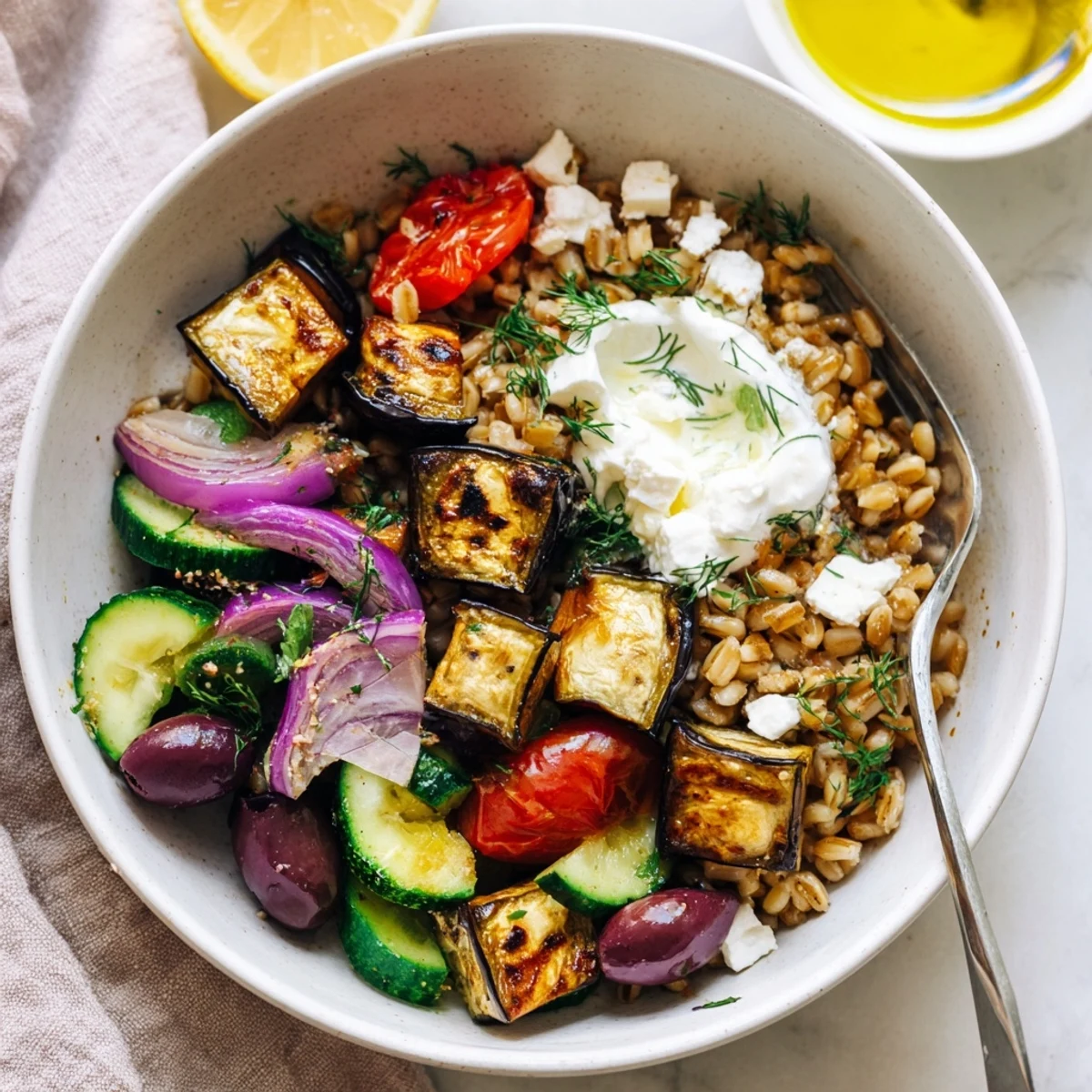 Mediterranean Roasted Eggplant Farro Grain Bowl with Yogurt, smoky oven-roasted vegetables.