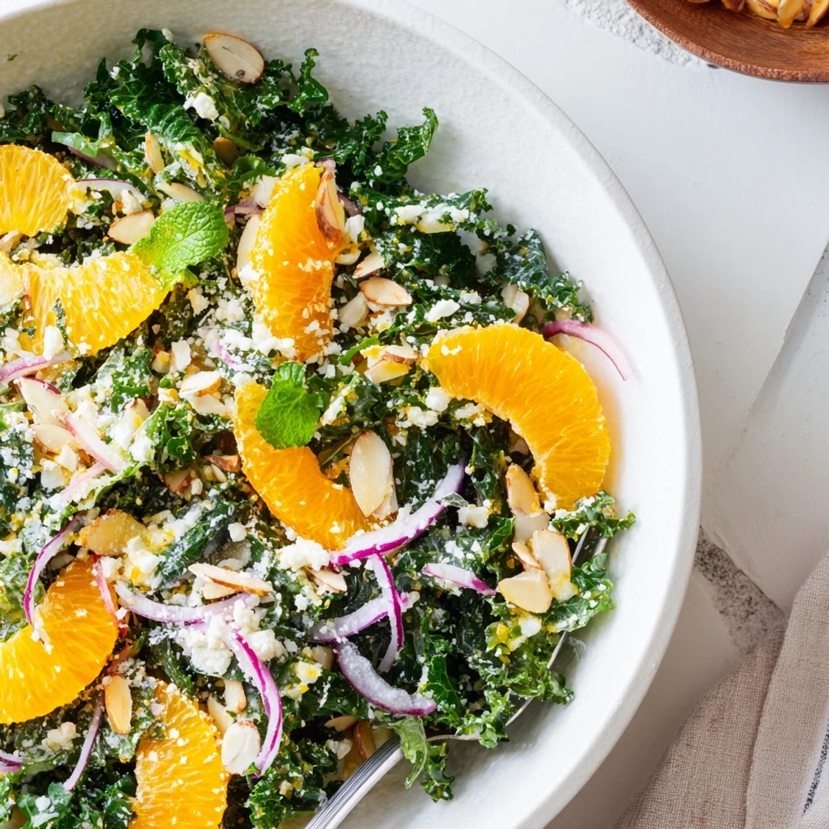Shaved Kale Orange Almond Salad Bowl with Citrus Dressing tossed, fragrant citrus, toasted almonds.