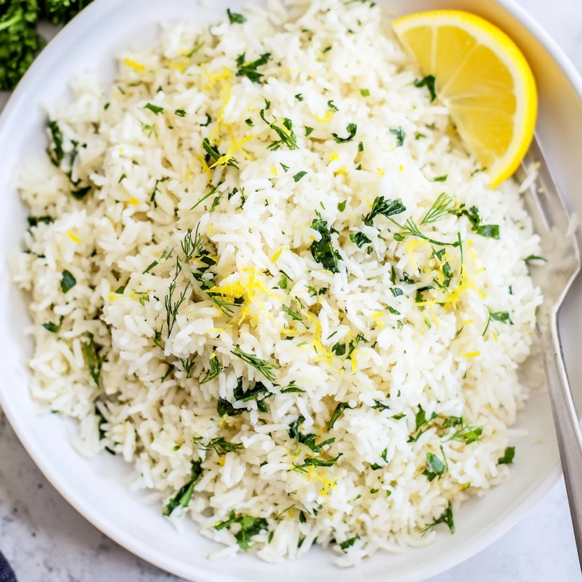 Garlic Lemon Herb Basmati Rice with Spinach served warm with lemon wedges