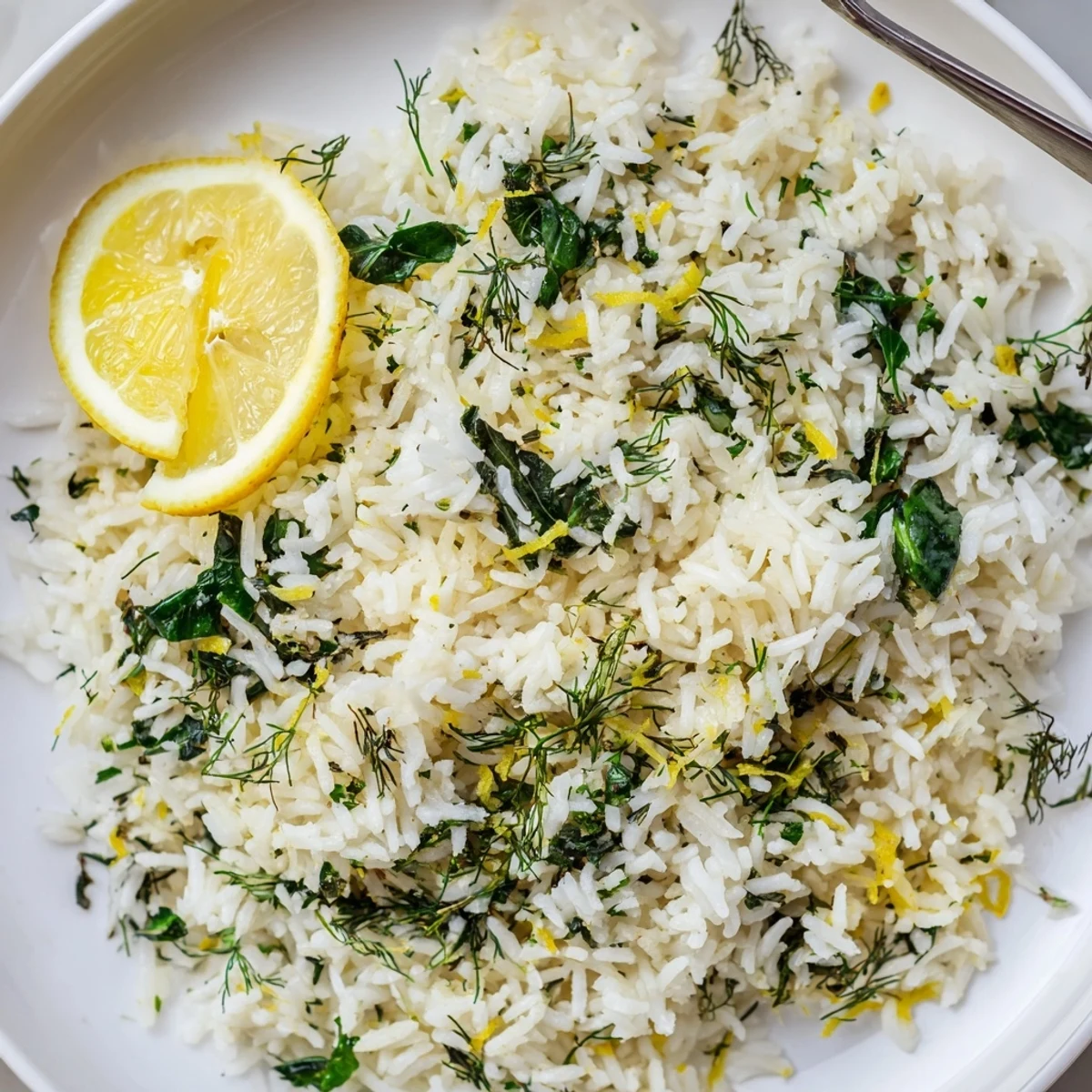 Bowl of Garlic Lemon Herb Basmati Rice with Spinach, wilted tender greens