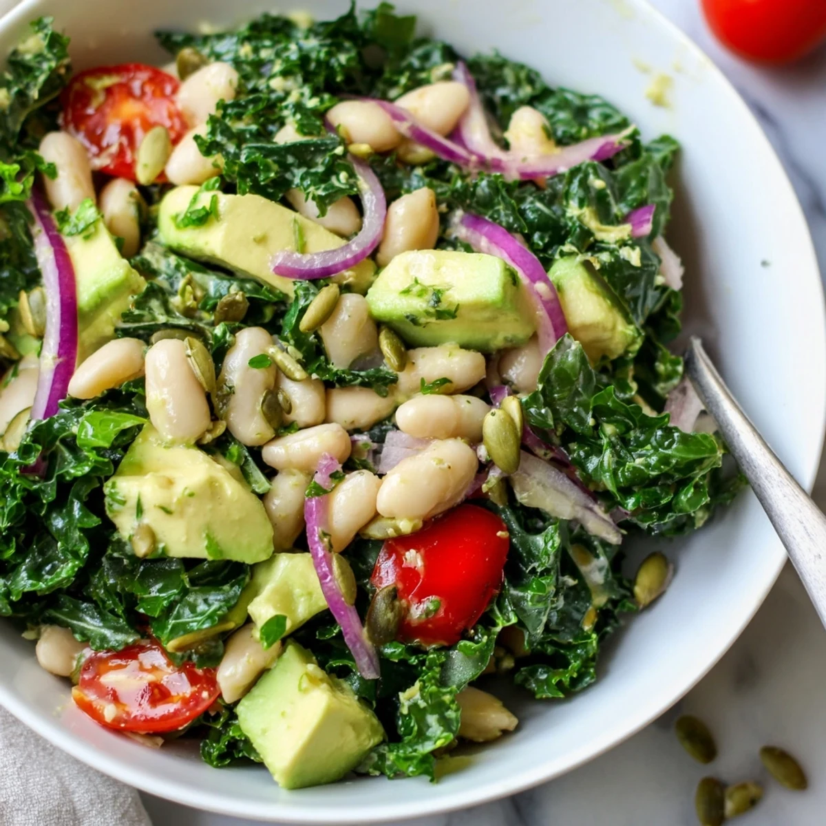Chilled and crunchy, Creamy Avocado White Bean Kale Salad Bowl with Fresh Herbs.