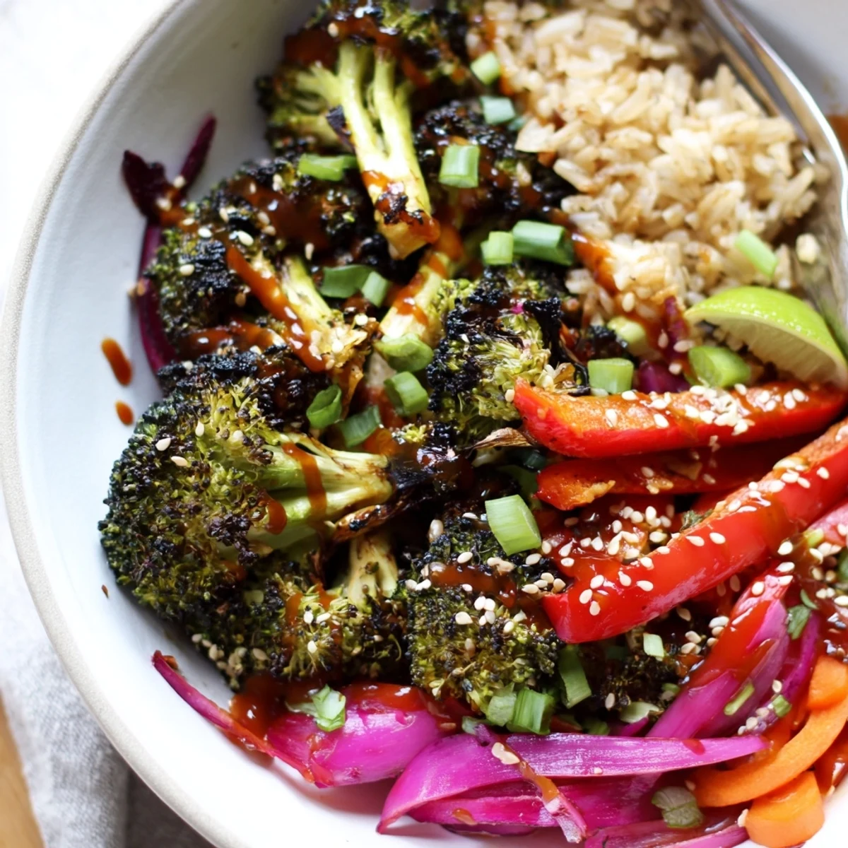 Spicy Gochujang Roasted Broccoli Veggie Bowl with Sesame Seeds, zesty lime and cilantro