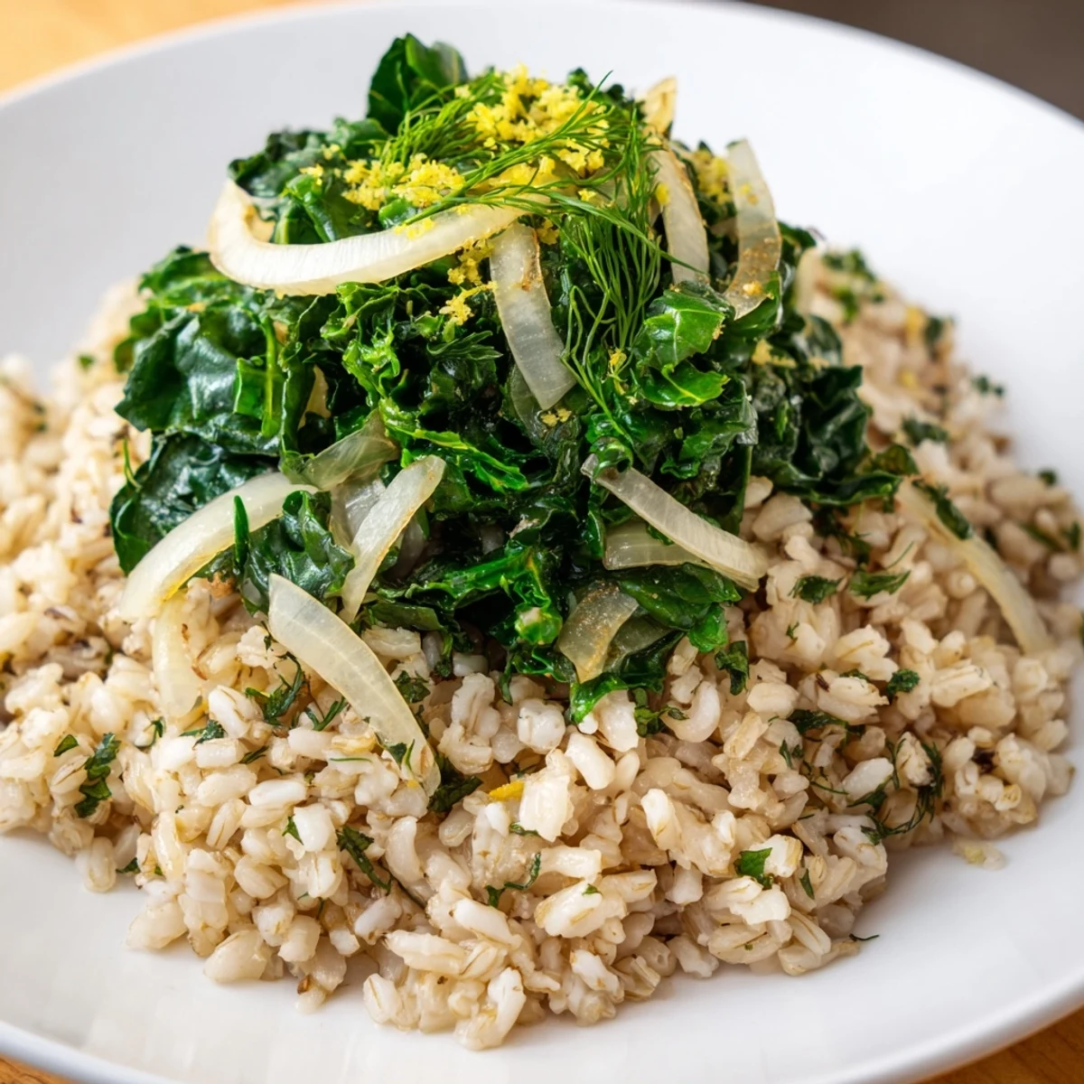 Mediterranean-inspired garlic lemon herb brown rice dish featuring tender wilted greens and fresh parsley garnish