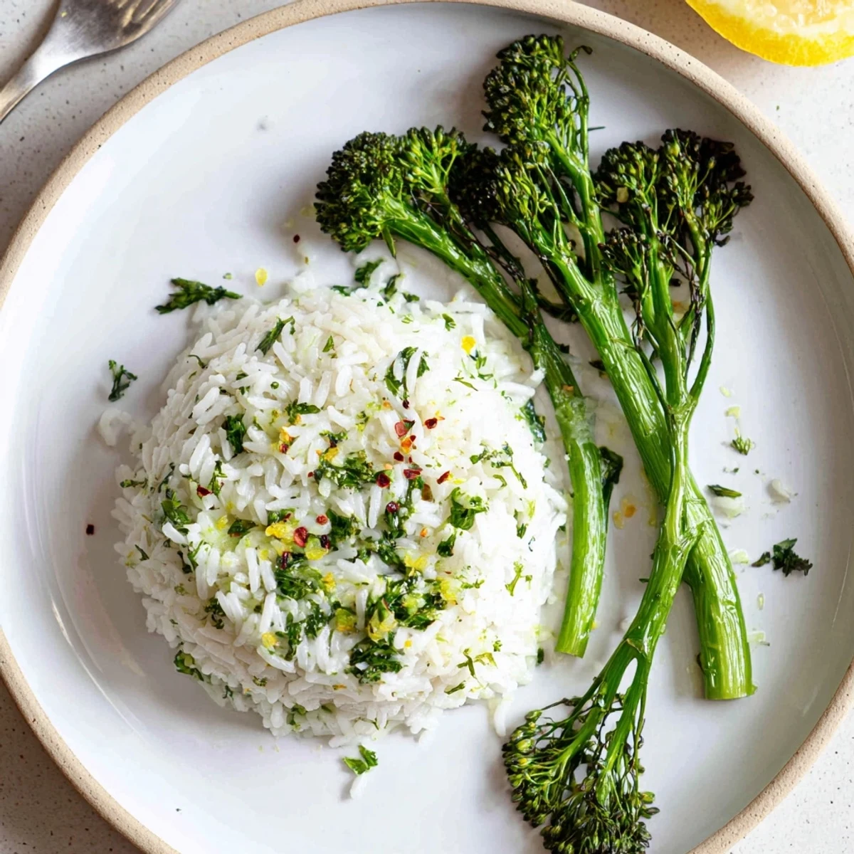 Steaming rustic bowl of Garlic Herb Basmati Rice with Roasted Broccolini, garnished with parsley