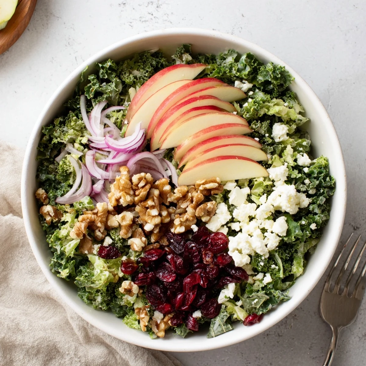 Serve Shaved Kale Apple Walnut Salad Bowl with Maple Dressing alongside grilled chicken.