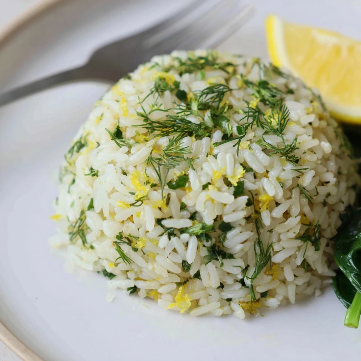 Bright citrus aroma tops Garlic Lemon Herb Jasmine Rice with Sautéed Spinach.