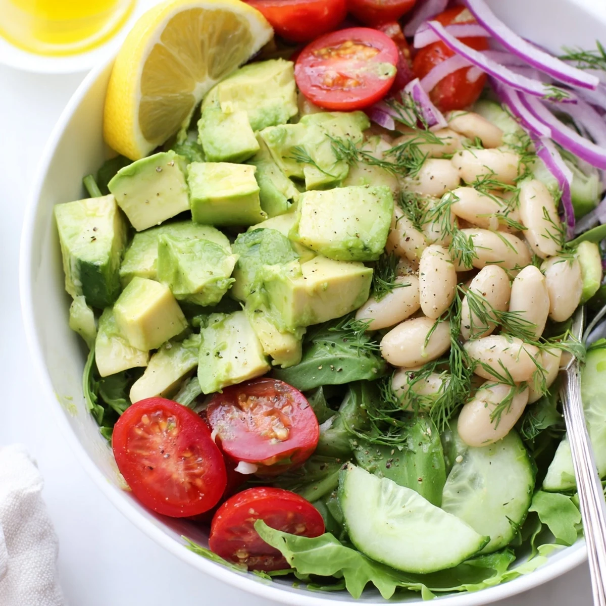 Creamy Avocado Dill White Bean Salad Bowl with Lemon, tossed gently for summer lunches.