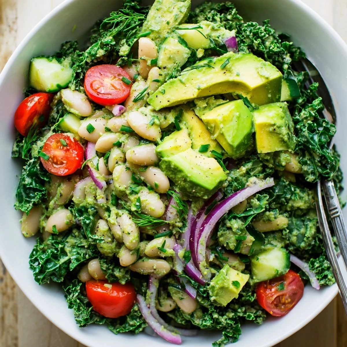 Served with toasted seeds, Creamy Avocado White Bean Kale Salad Bowl with Fresh Herbs