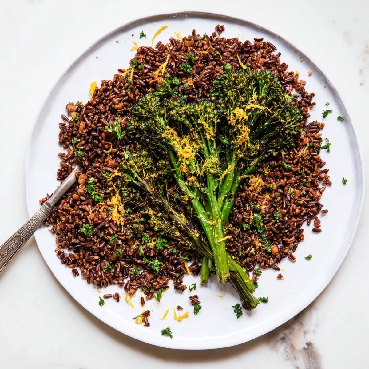 Vibrant bowl of garlic herb wild rice paired with crispy roasted broccolini and parmesan