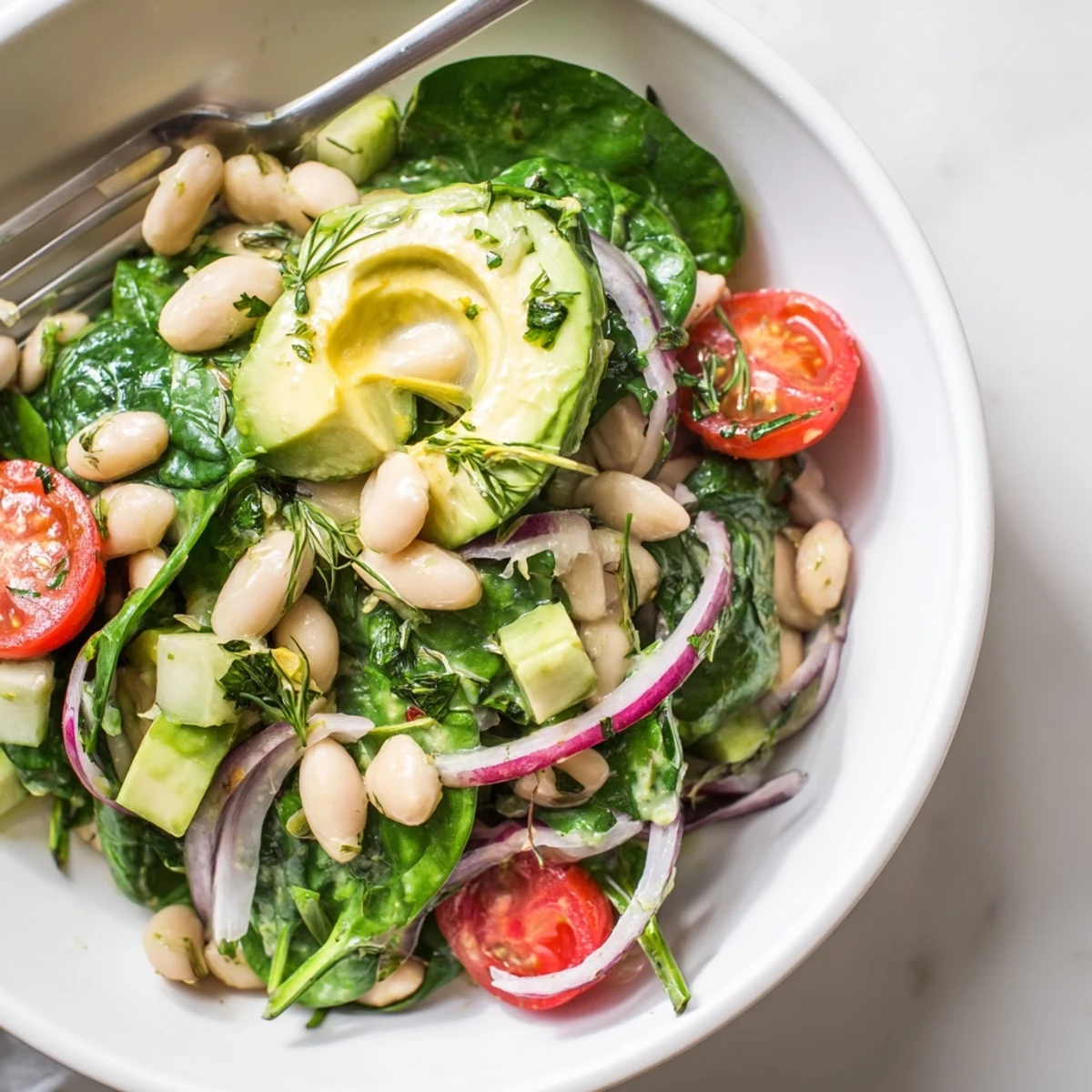 Creamy Avocado White Bean Spinach Salad Bowl with Fresh Herbs, silky avocado gleaming